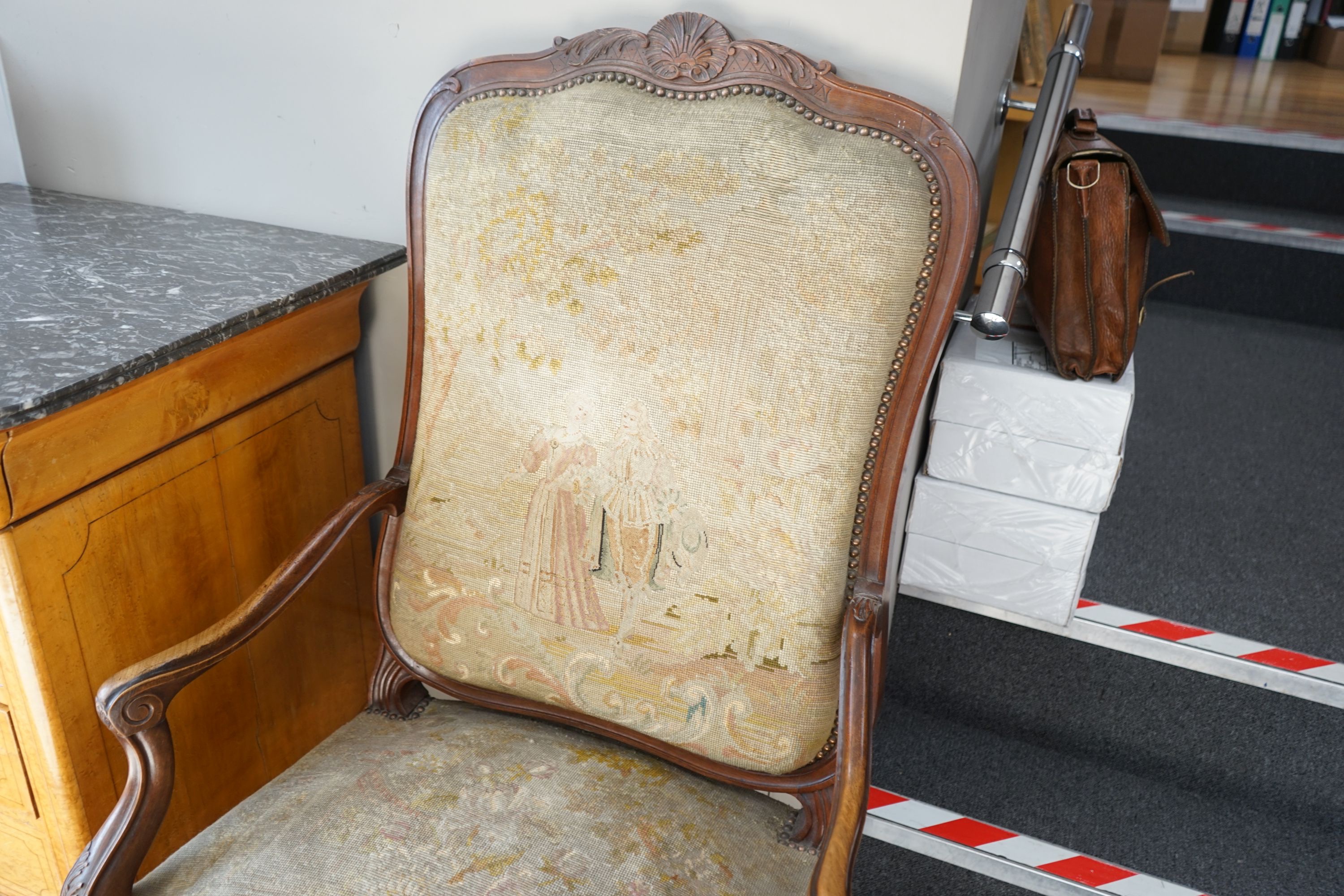 A pair of French carved walnut fauteuils with tapestry upholstery, width 75cm, depth 62cm, height 120cm